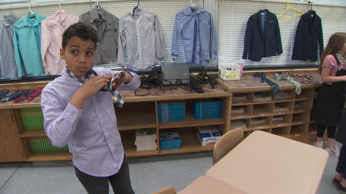 BoydHuppert's tweet photo. 9-year-old Jermaine McClure preps for "Dress for Success" at his St. Cloud elem school. On Tuesdays 4th graders don jackets, ties &amp; blazers - as a confidence builder. “When I wear it I feel better and I feel like I can get better at math." https://t.co/PUAhDvAq0n #land10kstories https://t.co/RMQ8EFle5m