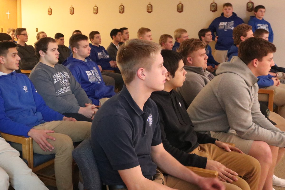 NewmanCCHS's tweet photo. @NewmanCCHS @NewmanFootball1 State Championship Rings arrived. The team and coaches gathered for Mass and blessing of the rings. #RollOnBlueMachine https://t.co/AW5cCPFDRm
