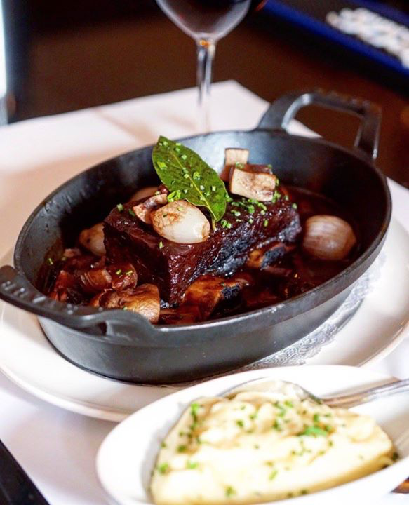 Beef Short Ribs Bourguignon. Pearl onions, button mushrooms, red wine, roasted garlic mashed potatoes. #BrasserieRuhlmann #ShortRibs #Bourguignon #French #Brasserie #RockefellerPlaza #RockCenter #Midtown #NewYorkCity #NYCeats #NYC