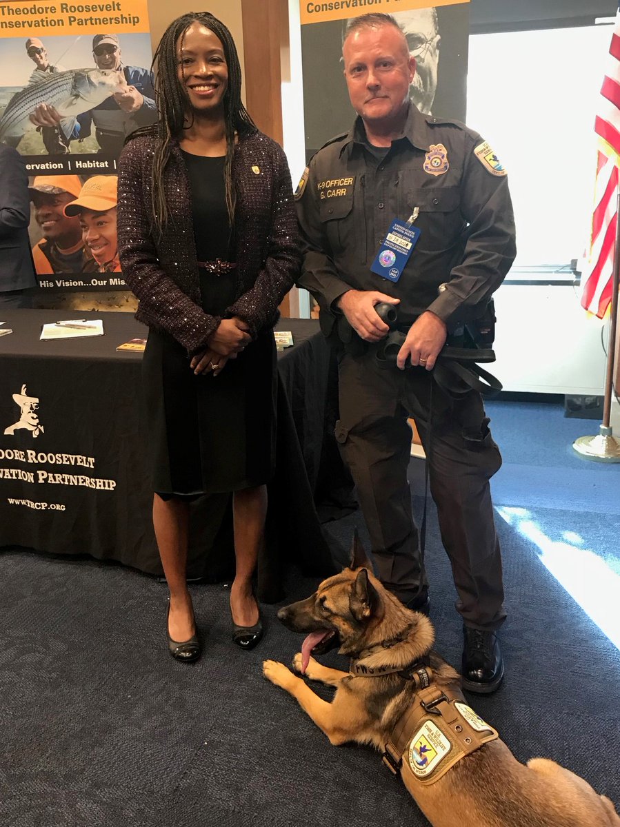 Director Skipwith with a representative from Refuge Law Enforcement, with his K9 Teal.