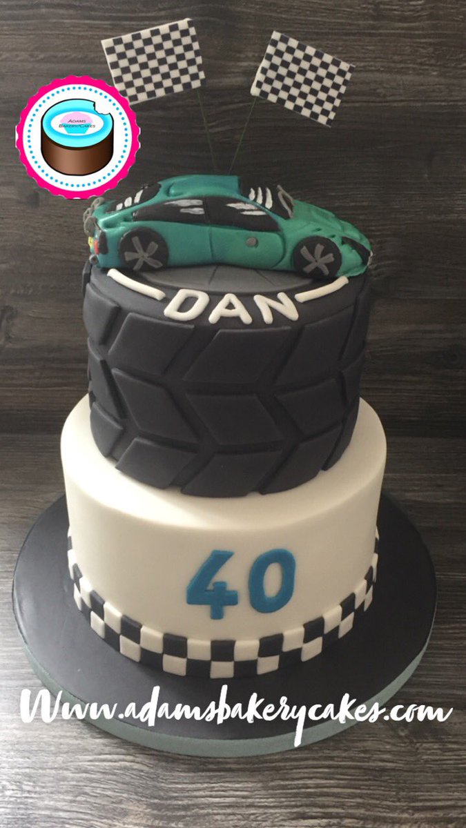 adamsbakerycake's tweet photo. Sharing some of my archived images waiting to be uploaded and forgot I had this one! 
2 tier racing car themed cake with full tyre top tier/ hand crafted and edible car topper ! 
https://t.co/voL2N0gnAr https://t.co/OJfJCjS7y9