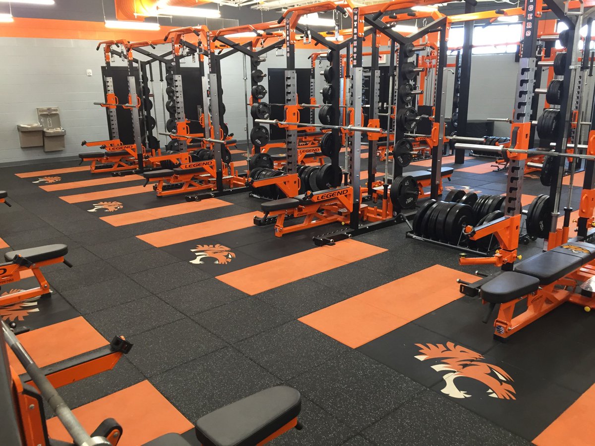 Regupol AktiPro tiles at Coweta High School. Great multi-color design with inlaid platforms and water jet cut logos. @cowetafootball @bestweightroom