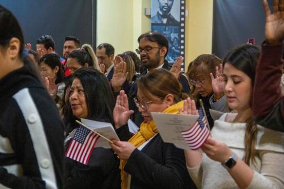 43 people from 24 countries traveled from 12 cities in Kansas to Brown vs. Board of Education National Historic Site to take the oath of allegiance to become U.S. citizens on the 159th Birthday of Kansas. 