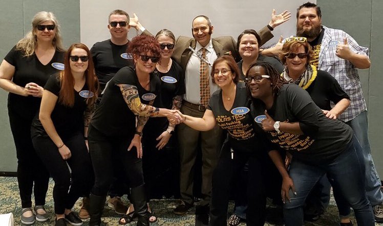 Group of people posing for picture