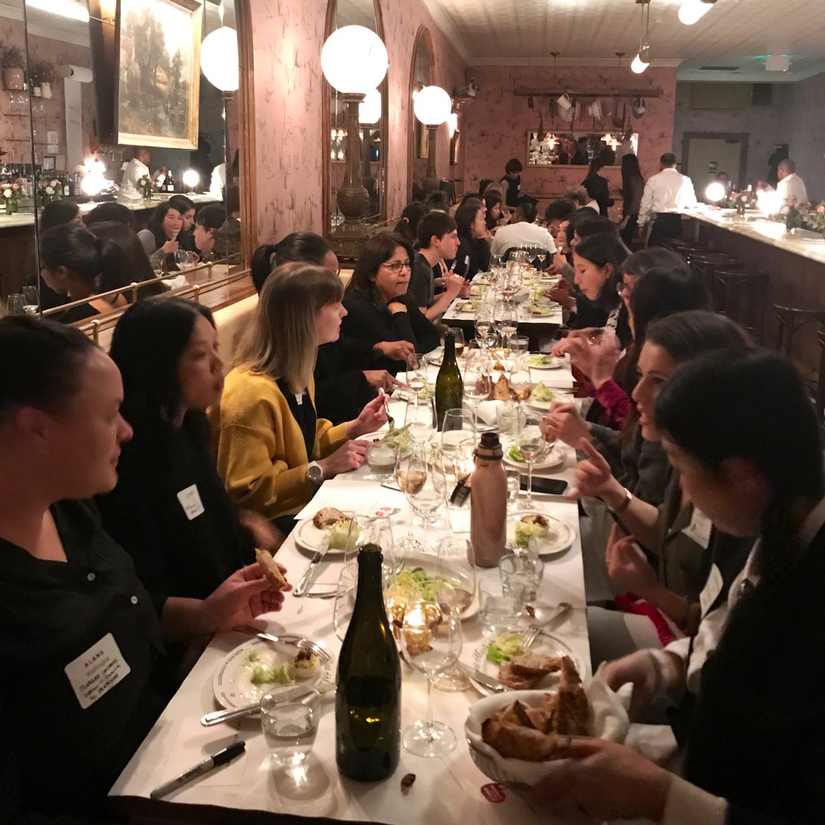 Table of women talk design speakers dining together at Petit Marlowe