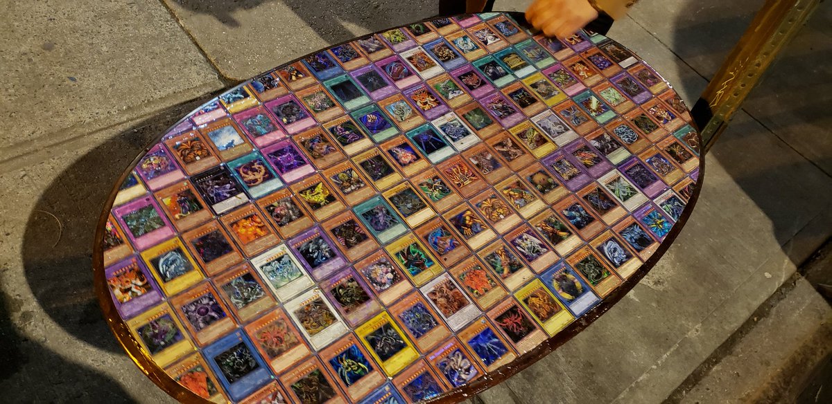 Last week when I was out with a friend we saw this really creative coffee  table that had been thrown out. It was tiled in Yu-Gi-Oh cards, it even had  all 5