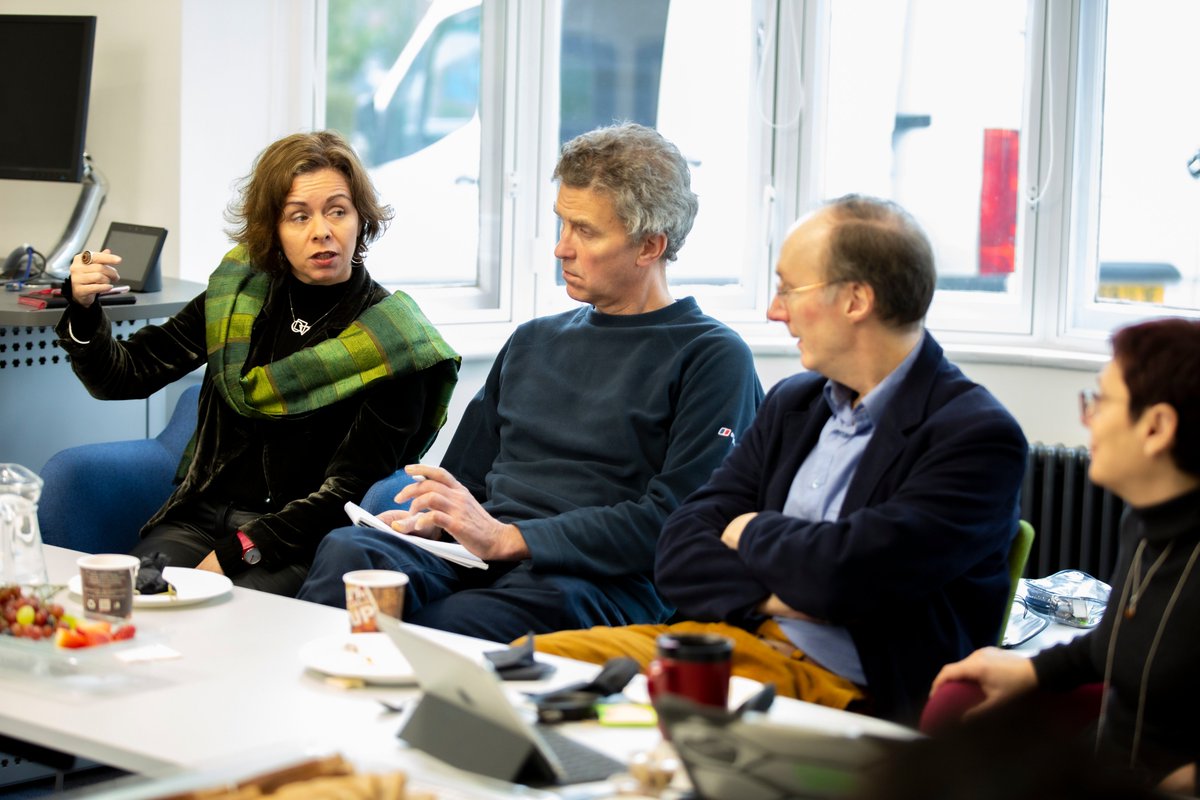 Professor Lyndsey Stonebridge introduces herself to the group, watched by Professor Miles Tight, Professor Max Saunders and Dr Lisa Gee.