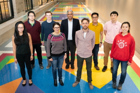 Anantha Chandrakasan, dean of the MIT School of Engineering, is standing with a group of MathWorks Fellows. 