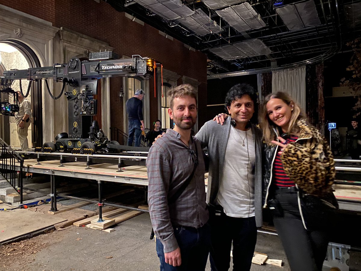 MNightShyamalan's tweet photo. The first two episodes of @Servant season 2 are wrapped. Julia Ducournau killed it. Brooding, shocking &amp; cinematic. This is me &amp; our cinematographer Mike Gioulakis with her after last shot. We wish her all the best on her next feature she’s going to shoot back at home in France! https://t.co/1ufNrGH3nT