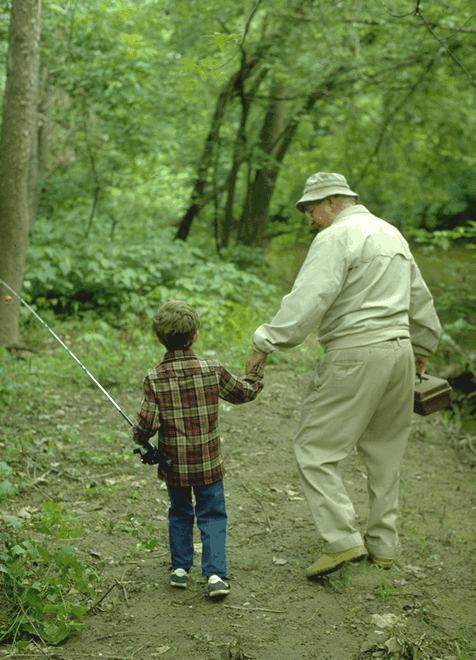 Forest use spans generations. This man shows his grandson the way to a special place.