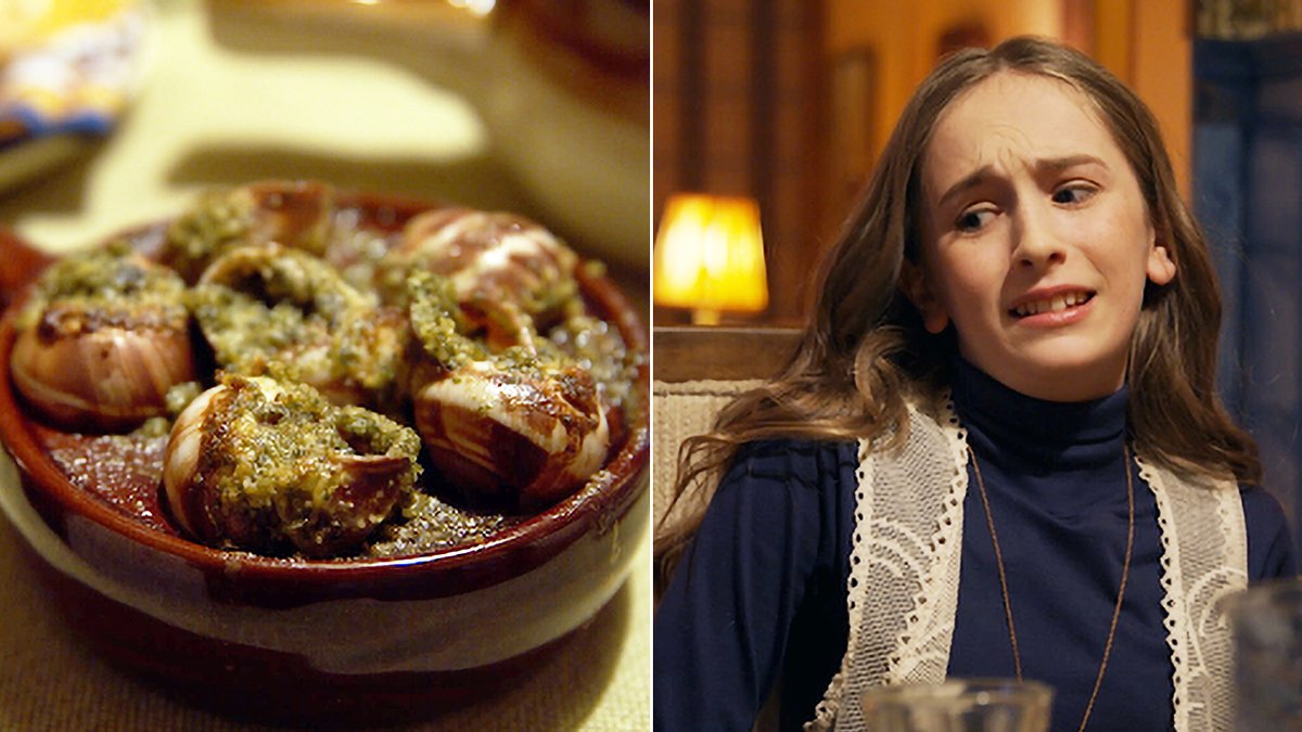 A girl looks grossed out by a plate of escargot