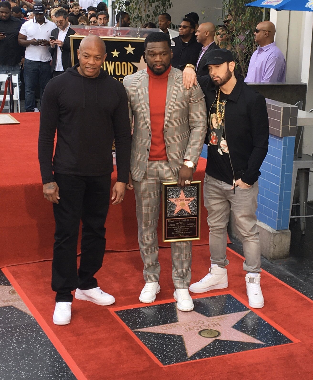 50 Cent getting his Star on the walk of fame while flanked by Dr Dre and  Eminem. Some white-hot kicks on…