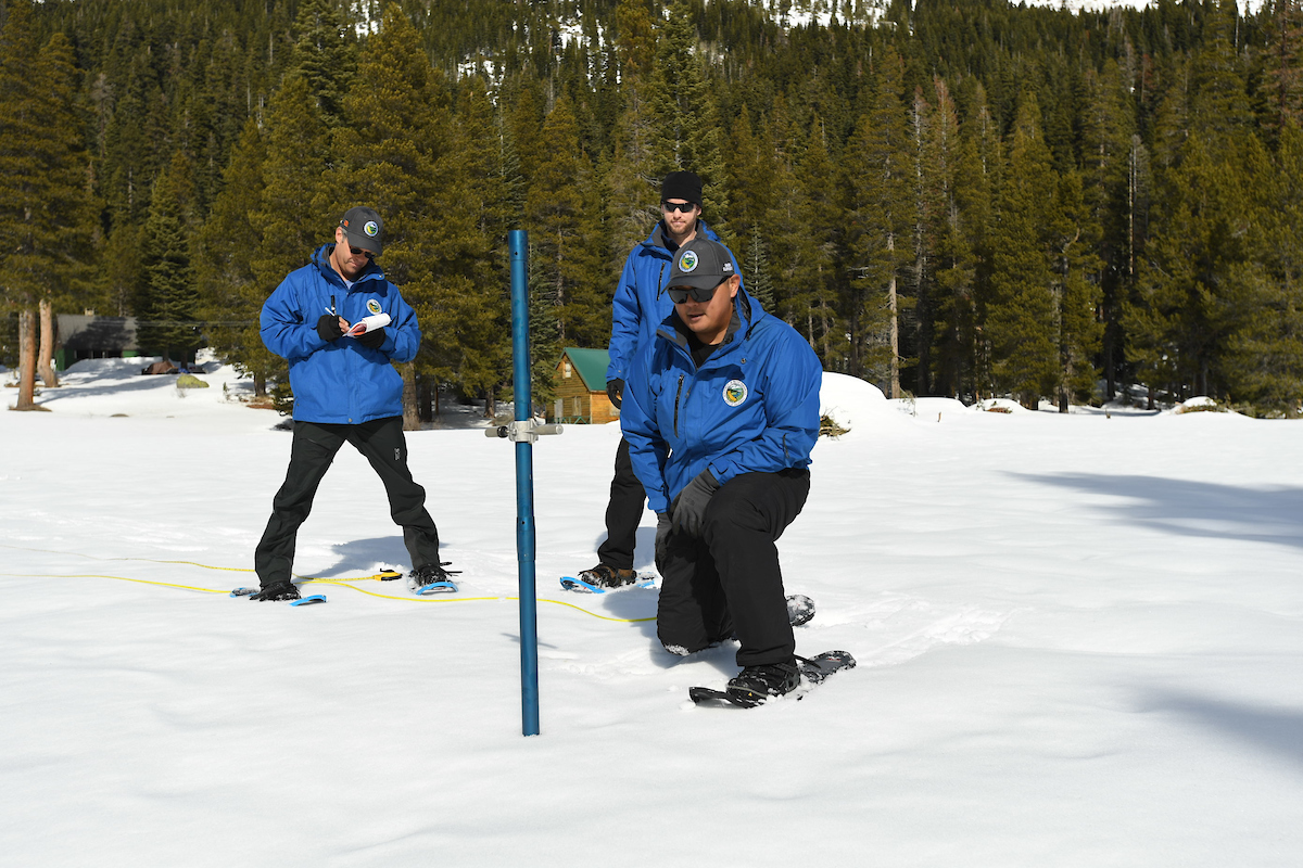DWR employees take measurements for the second manual snow survey of 2020.