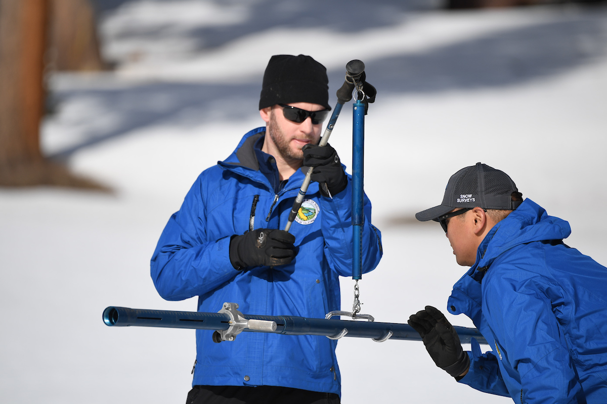 DWR employees take measurements for the second manual snow survey of 2020.