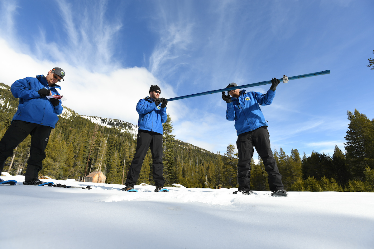 DWR employees take measurements for the second manual snow survey of 2020.