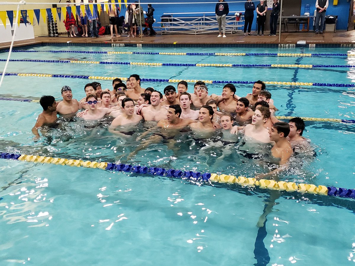 Singing the alma mater in the last home meet of the season.
