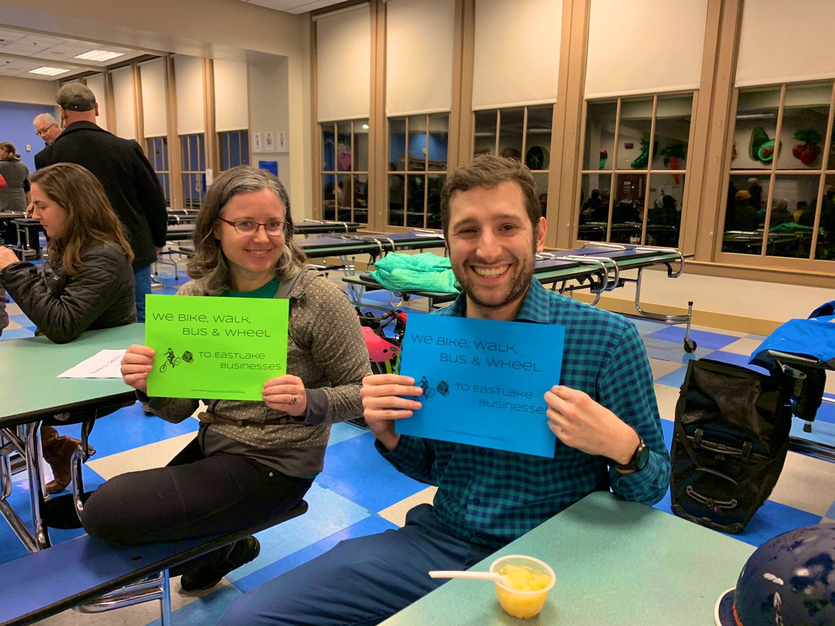 People holding up the signs