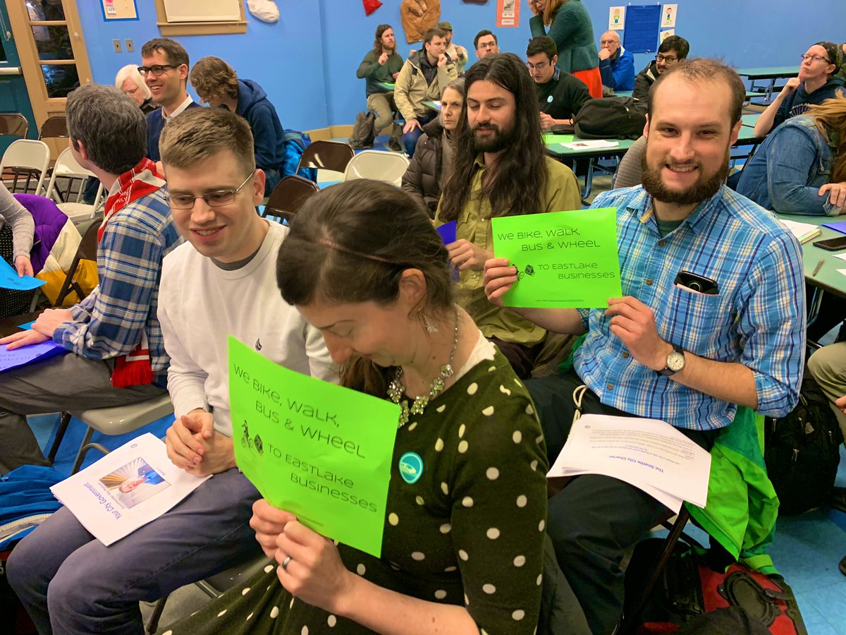 People holding up signs in support