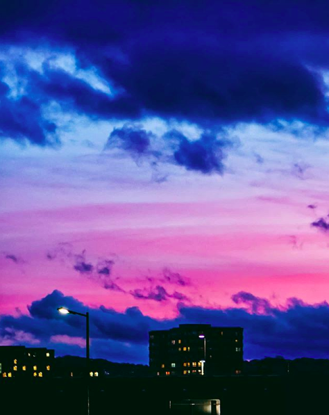 Pink evening sky over buildings in the city