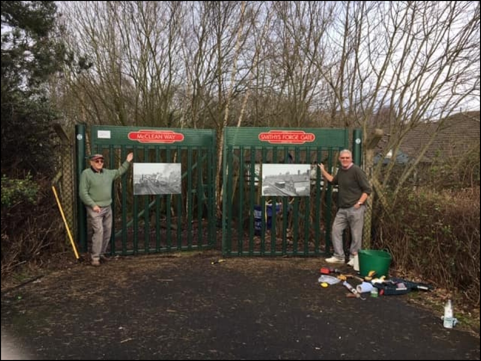 Barry and Brian with the artwork by Smithy's showing north and south railway views in it's heyday