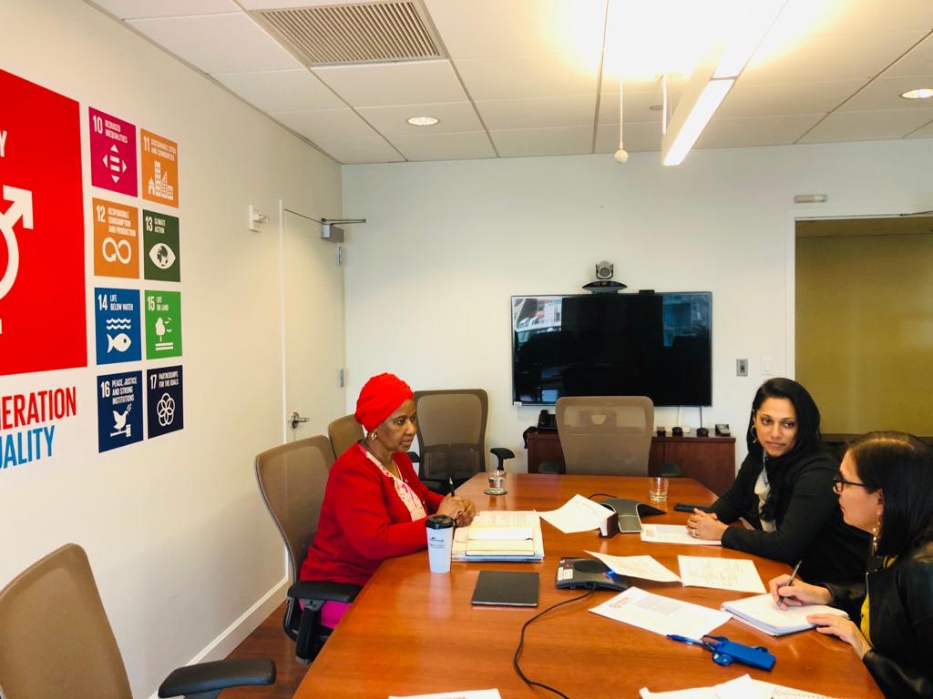 Commissioner Abeywardena, the Executive Director of UN Women, and a staff member sit at a conference table.
