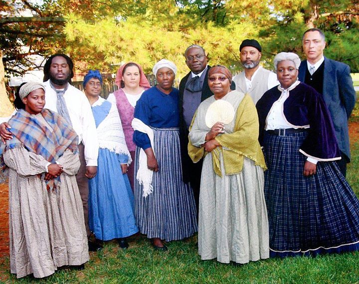 The Jubilee Voices ensemble dressed in Civil War-era clothing; most of them are dark-skinned individuals.