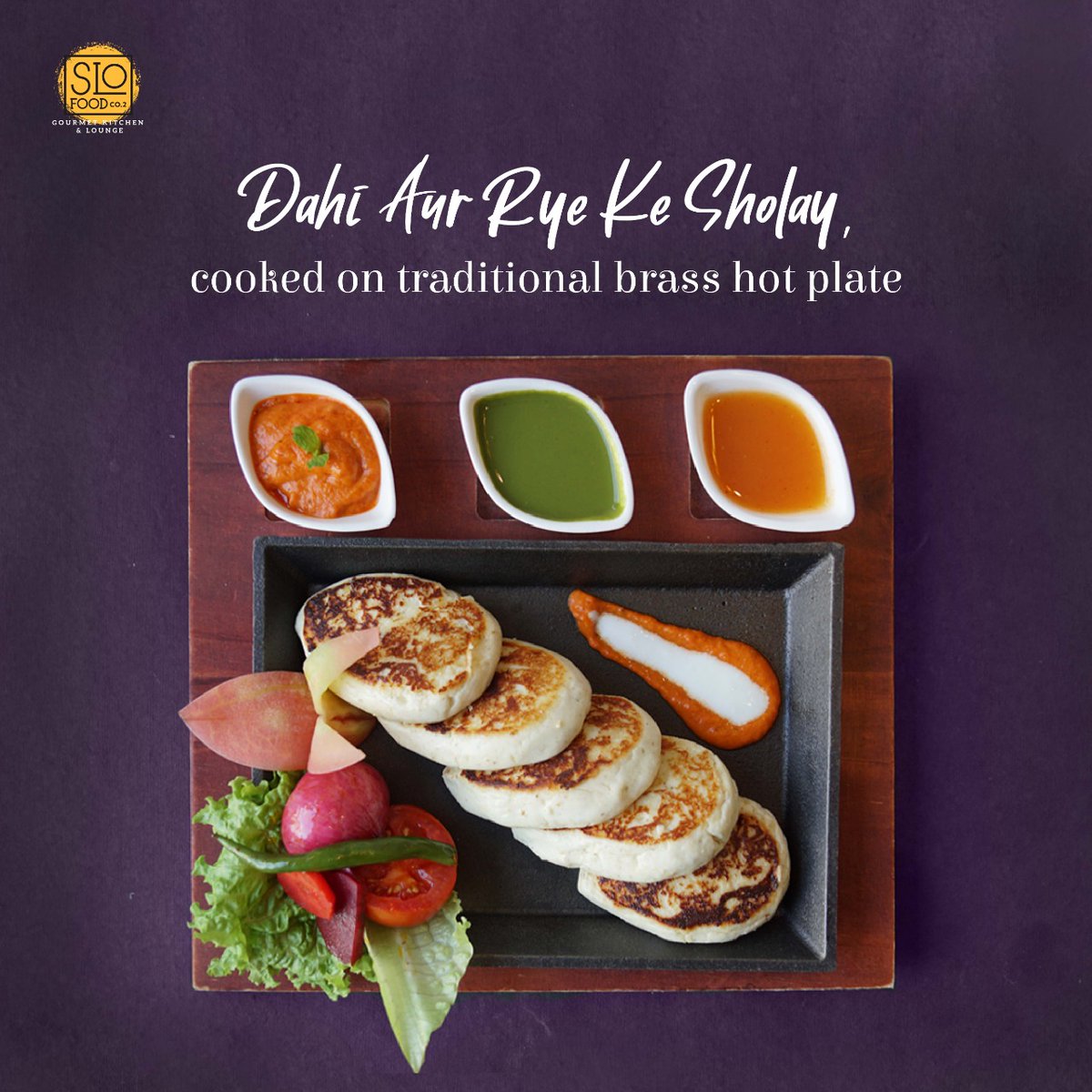 SloFoodCo's tweet photo. The Dahi Aur Rye Ke Sholay made up of hung yogurt infused with roasted organic ragi, stuffed with prunes is turned into healthy cutlets, slow-cooked on brass lagan in ghee, available at Slo Food Gourmet Kitchen &amp; Lounge.
For Reservations, dial 6364900199.
#SloFoodCo #SlowCooked https://t.co/IrO0RKsAtS