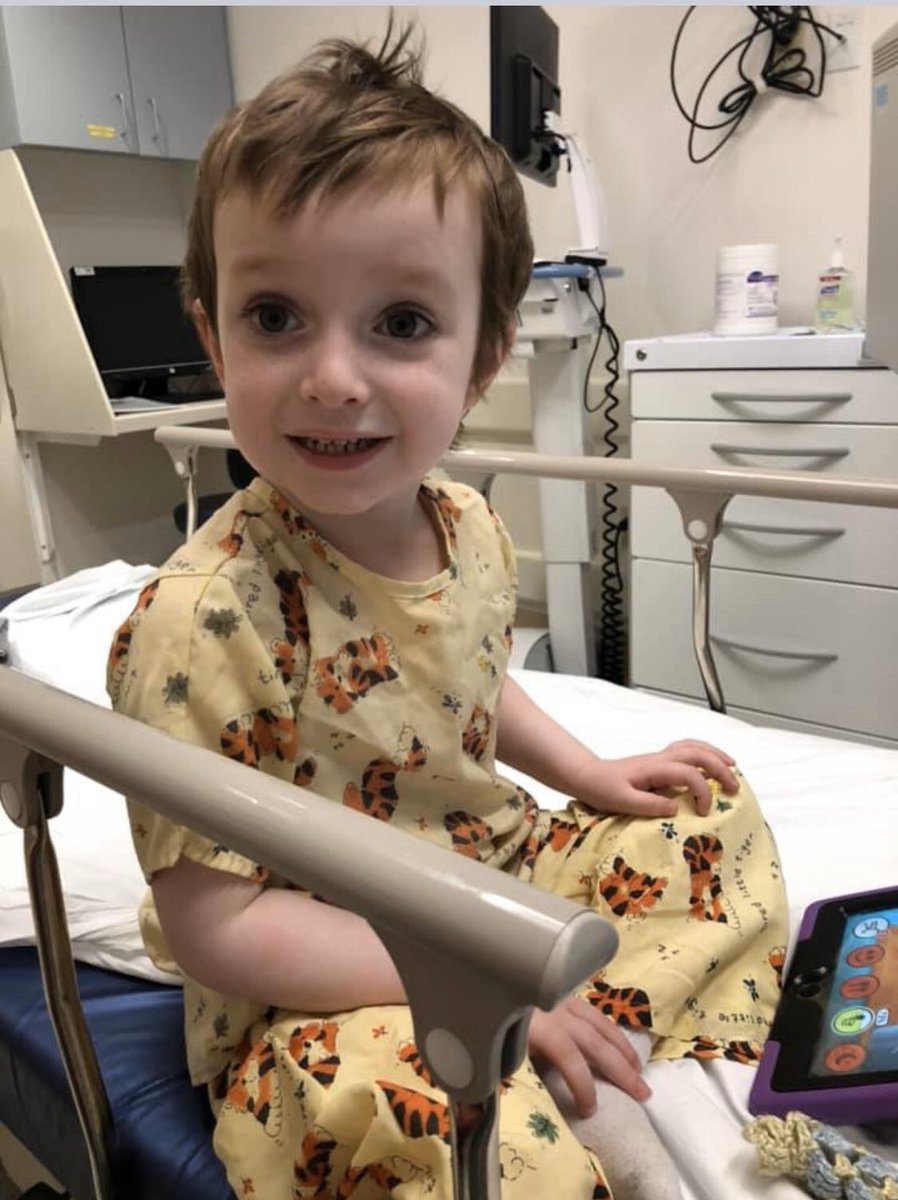 Quinn sitting in hospital bed