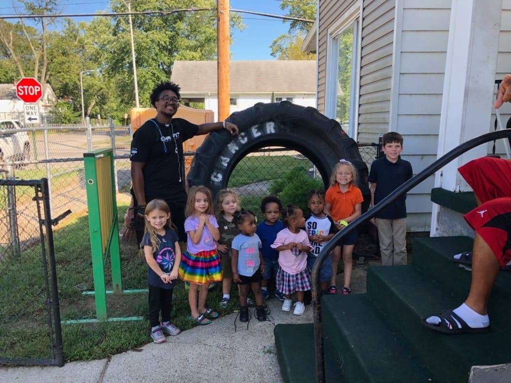 Hanging with the kids in the Community! They enjoy the tire!