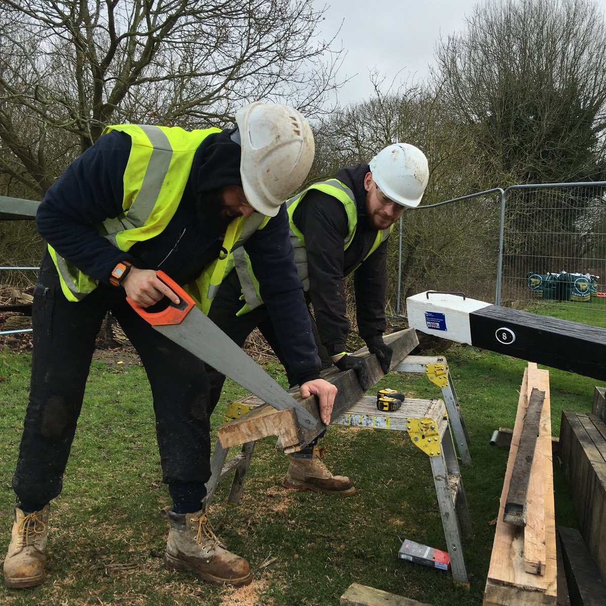 Neale and Jordan cutting new cill to be fitted in the top lock Foxton