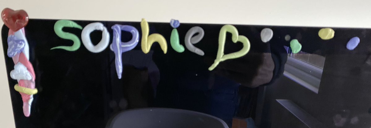 The front of an iMac with Sophie drawn on next to a heart.