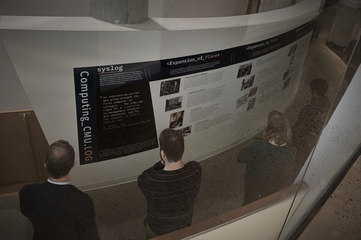 People visiting display on history of computing at CMU
