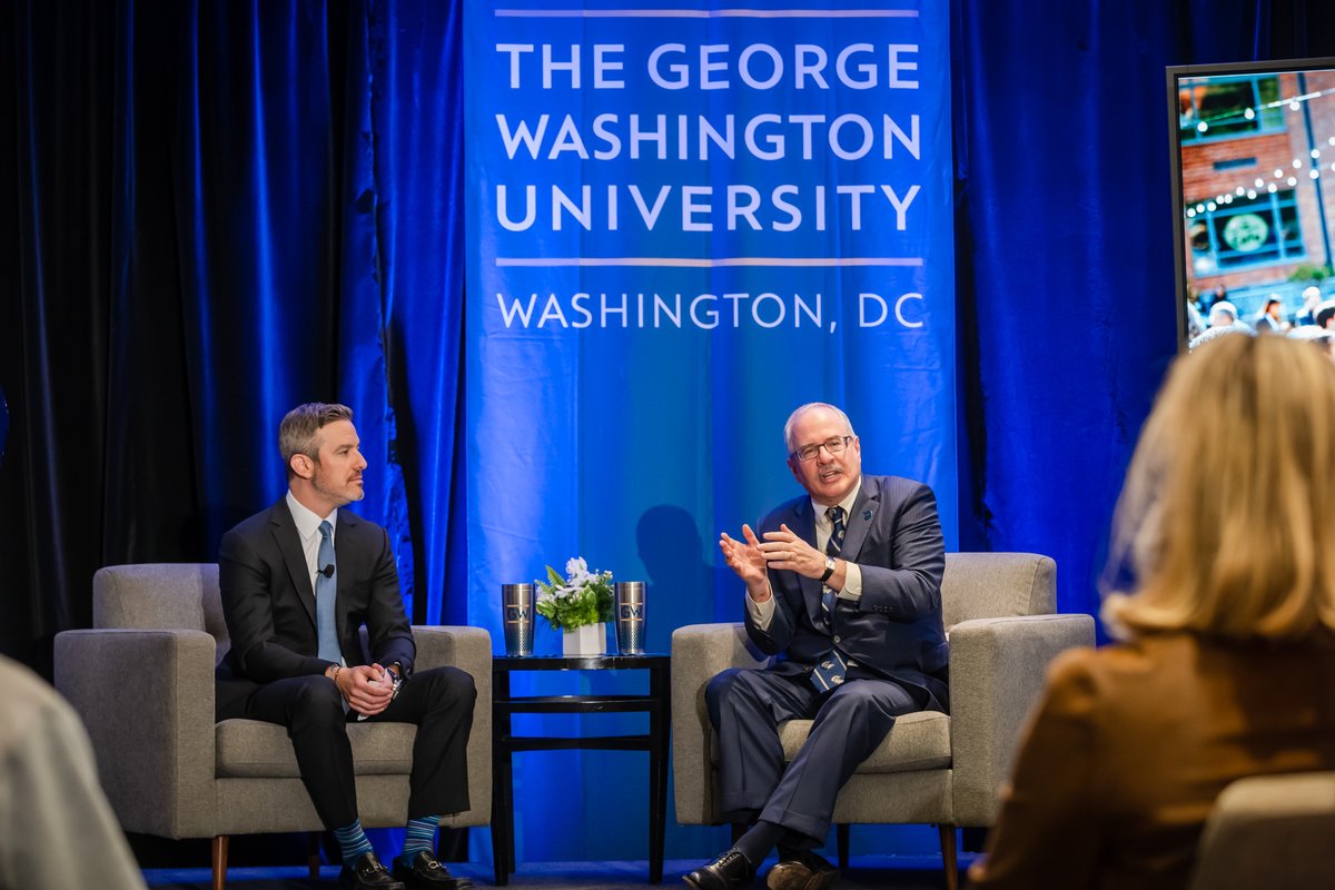 president leblanc on stage with a man moderator