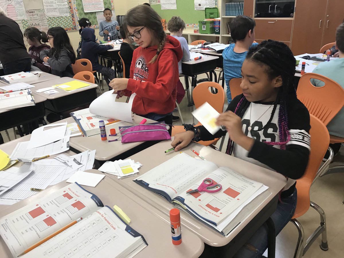 Math_Sherrie's tweet image. Students working on fraction understanding in Mrs. Haeufle’s 4th grade class at RW by making fraction cards.#BigBlueOnTheMove