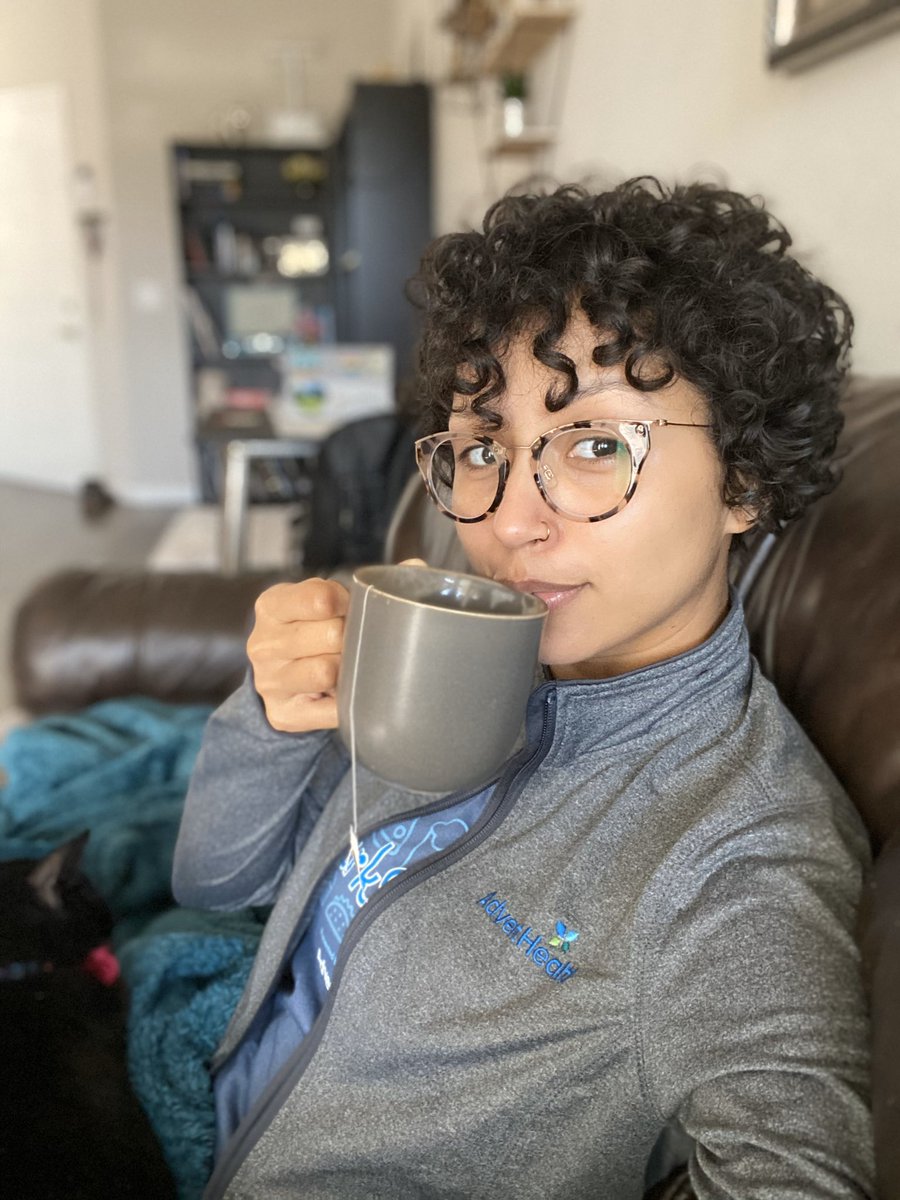 Curly girl drinking tea