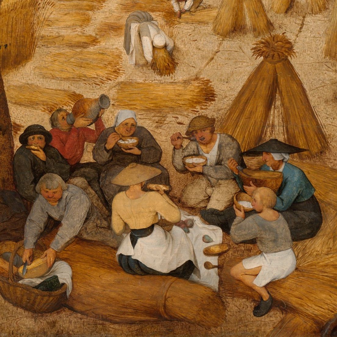 Detail of a group of harvesters having lunch under a tree. 