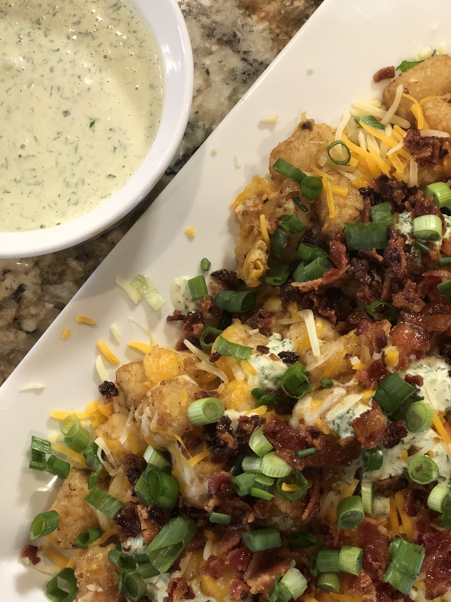 TanorriasTable's tweet photo. @TheKitchenista Loaded Tots w/ Tangy Buttermilk Ranch: Tots cooked in bacon fat and loaded with cheese, bacon, homemade ranch and scallions. So flavorful. So good. Perfect for #SuperBowl2020 #foodblogfriday #tanorriastable #bacon #tatortots #gameday https://t.co/dWopAk5q6s