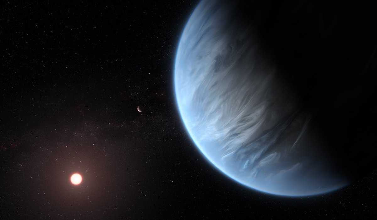 An artist’s impression of K2-18b orbiting K2-18 with another planet in the system. A blue planet with a cloudy, streaked surface is in the foreground, with a red star in the background along with another planet. [ESA/Hubble, M. Kornmesser]
