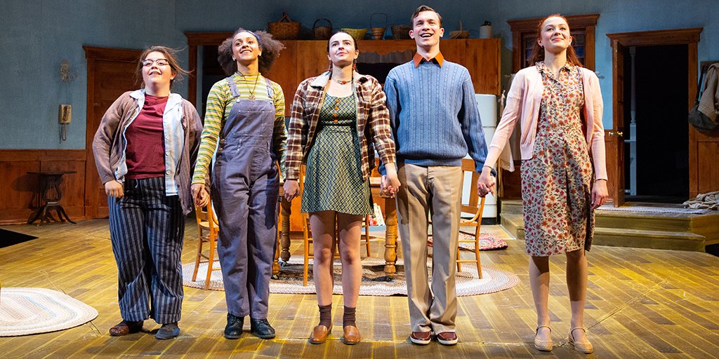 Five cast members take a curtain call