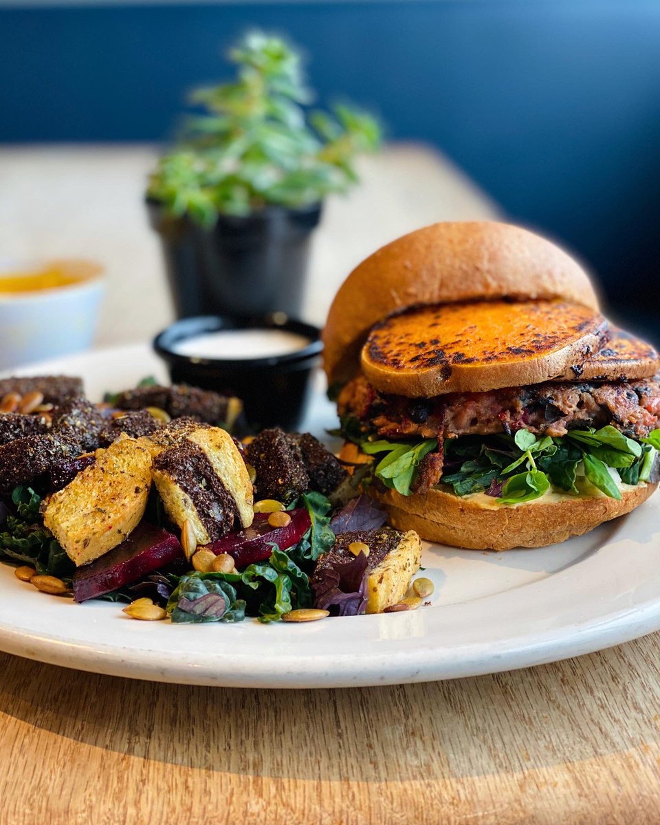 🌱Friday’s Special🌱
“Sasquatch Burger”
-black bean patty, grilled sweet potato rounds, local kale, hummus, sprouts, apple relish &amp; comes with a side! (SF, NF)
Side of the Day: Local raw kale, toasted rye bread, pumpkin seeds, roasted beets, coco-yogurt dressing! (SF, NF)
