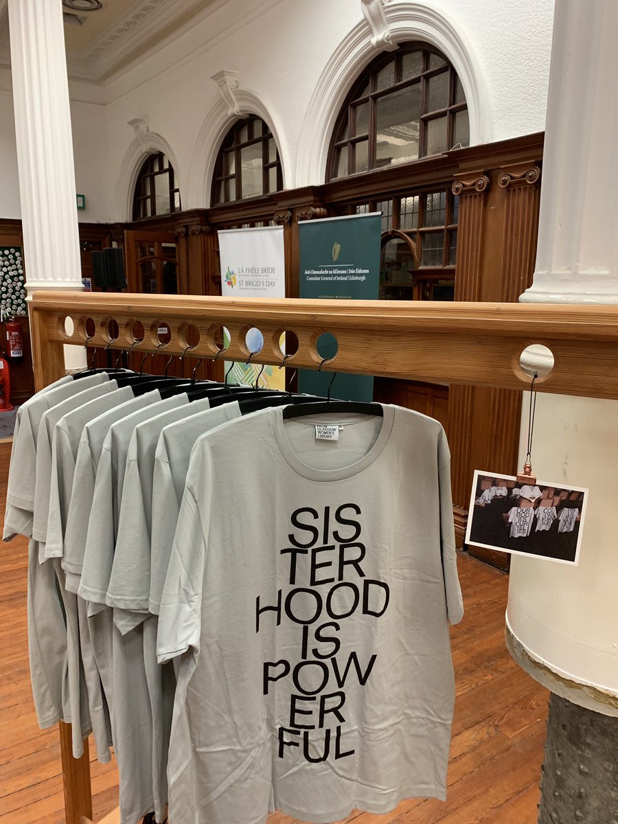 A t-shirt with “Sisterhood is powerful” written across it hanging on a Coat rack at the Glasgow Women’s Library
