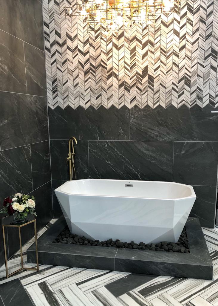 Daltile's tweet photo. After a busy @TISEevents, relaxing in this gorgeous bathroom surrounded by our new Vertuo #tile collection - coming this spring - tops our list. What about you? #tise2020 #surfaces2020 #daltile https://t.co/9LJpN97qwh