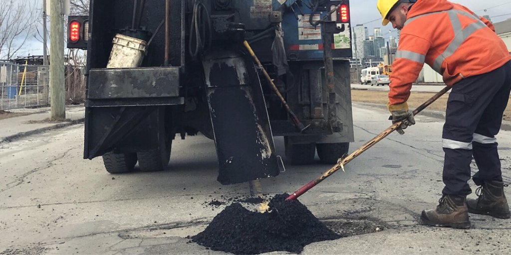 Photo of a pothole being filled on a Toronto road