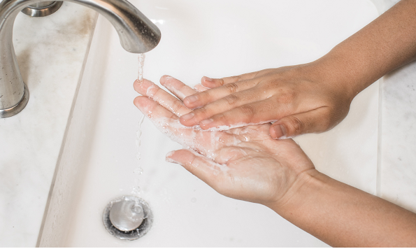 Close up of washing hands at sink