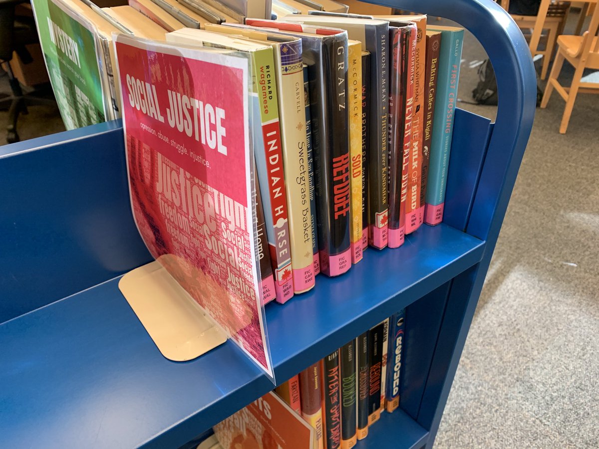 esther_memmott's tweet photo. Our newly #genrified fiction is going on the road on a cart set to visit the English 10 classes! #tlchat #librarylife #genrify https://t.co/eyiQWN51bR