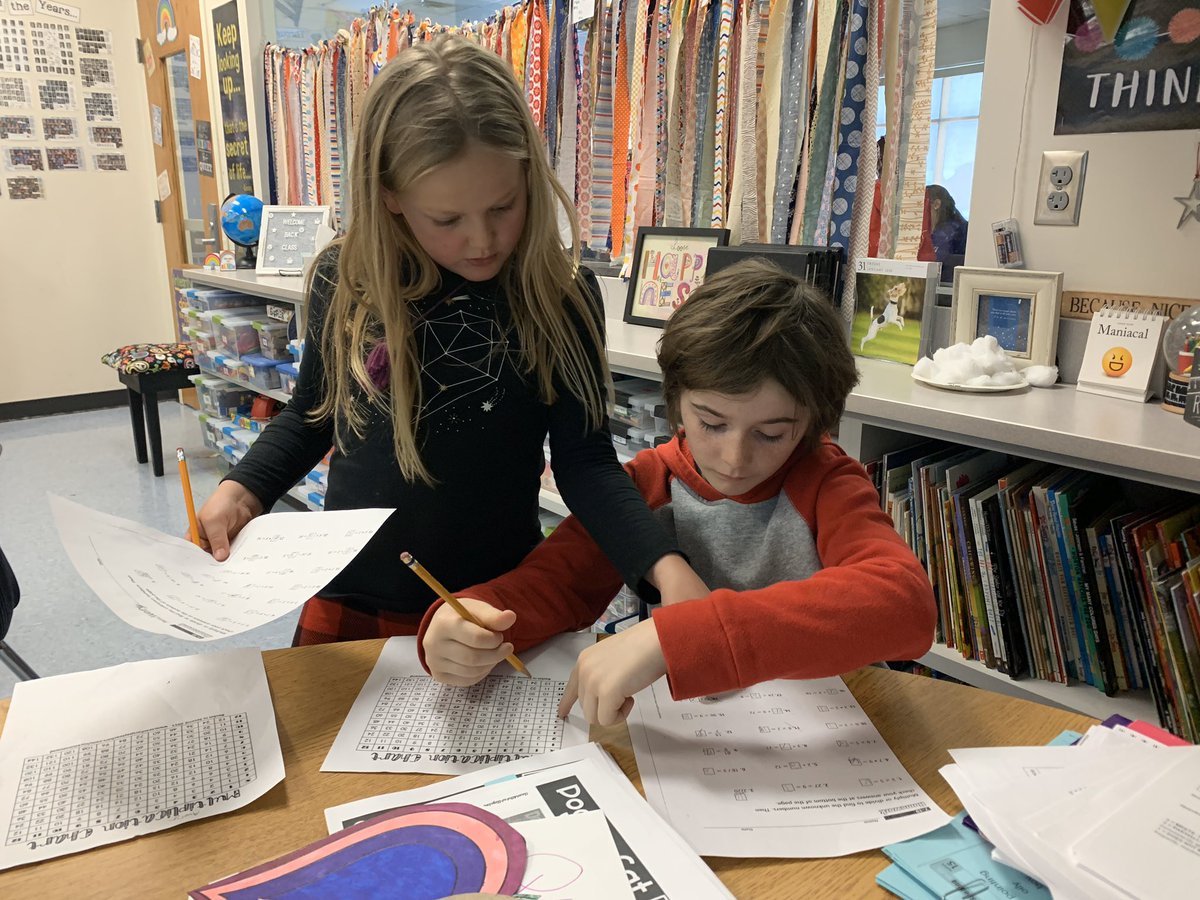 sarahvmn's tweet photo. Kids helping kids learn how to use the multiplication chart and practice their facts #lmemagic #montimagic #suchhardworkers https://t.co/bl1XdI3alU