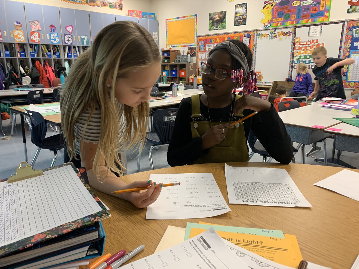 sarahvmn's tweet photo. Kids helping kids learn how to use the multiplication chart and practice their facts #lmemagic #montimagic #suchhardworkers https://t.co/bl1XdI3alU