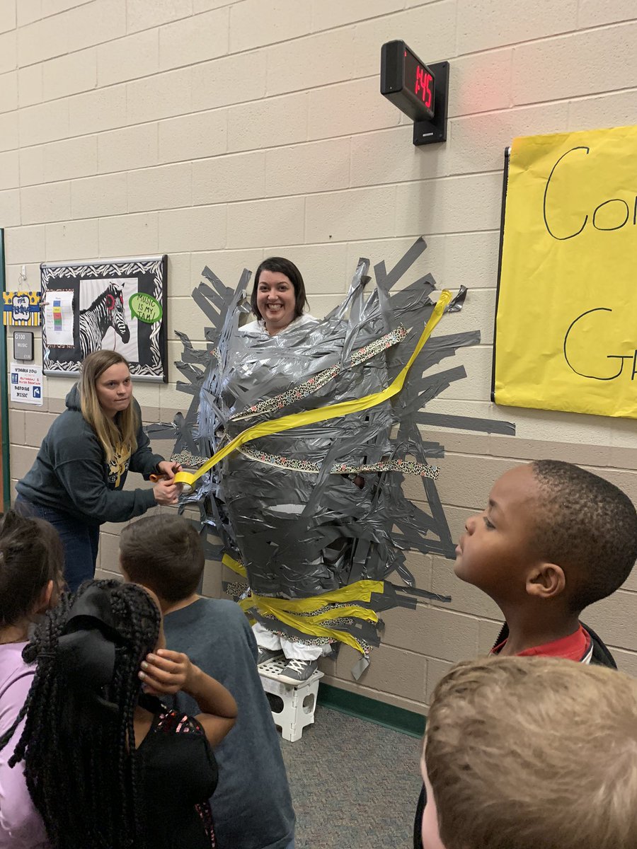 MetcalfNat's tweet photo. When 1st grade wins the canned food drive, we get to tape the principals to the wall! So much fun! #presspride #mymisd https://t.co/TBq2e0BRTY