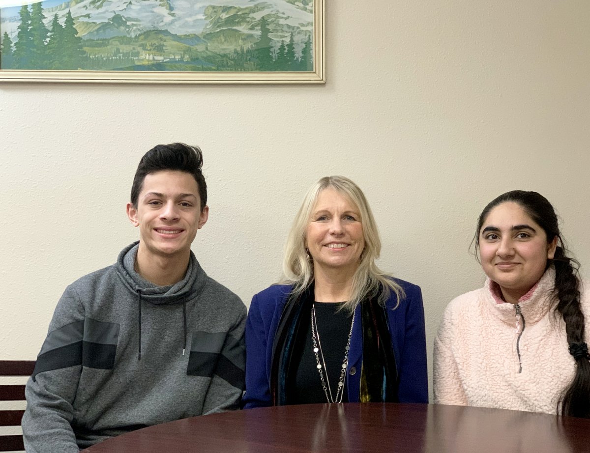 Superintendent Dr. Linda Quinn with student school board members Noah Semu and Avneet Pannu