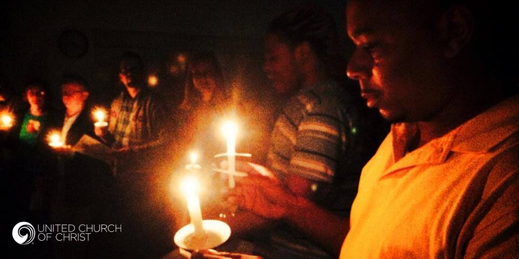 Photo of people of color at a candlelight service